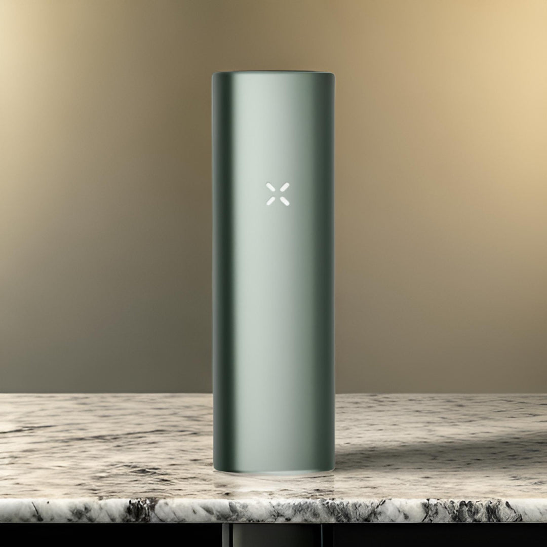 Vaporizador pax plus color verde, sobre mármol